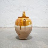 Old gargoulette pot in glazed terracotta