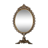 Swivel table mirror in golden metal