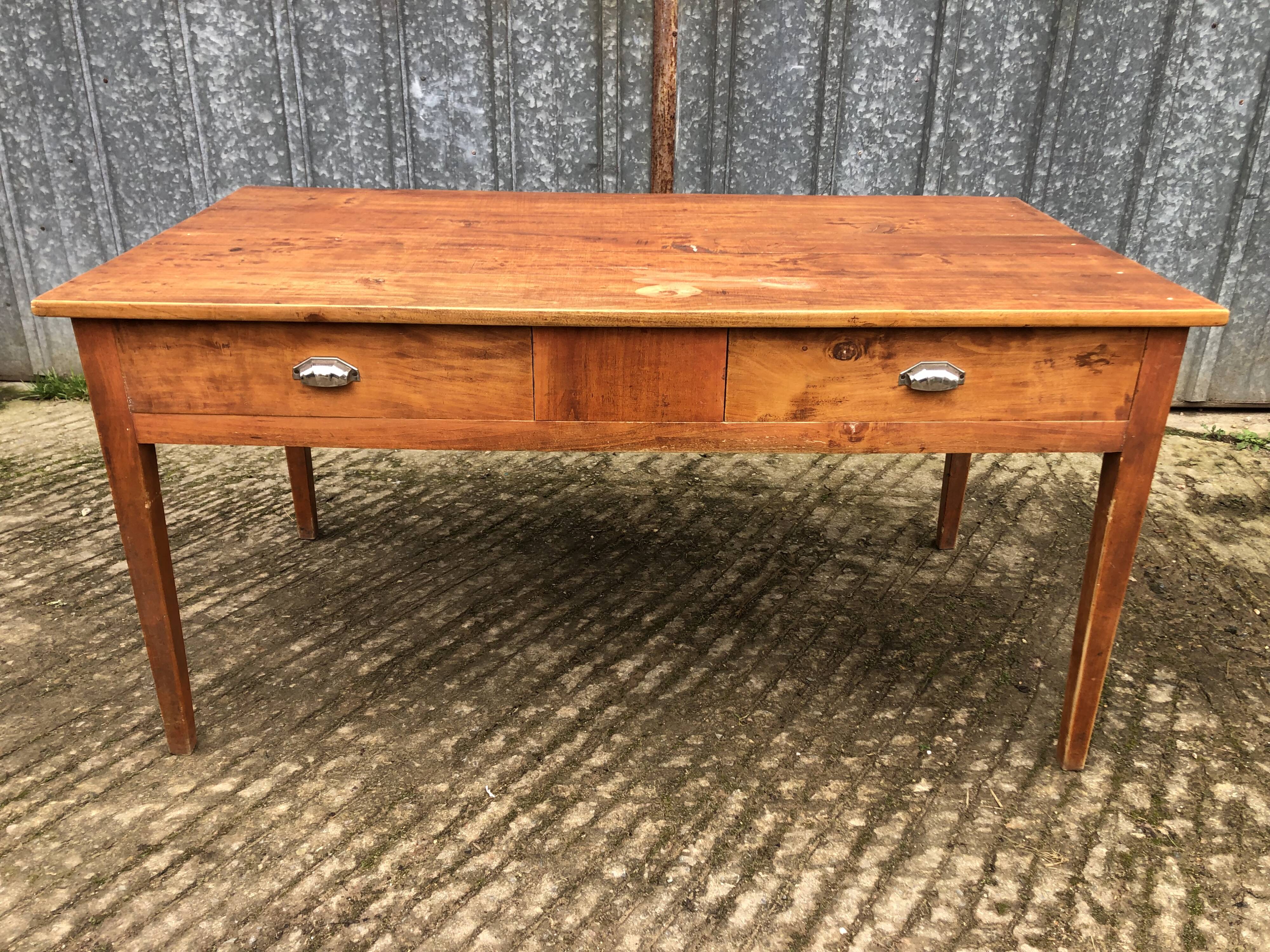 Poplar wood table with 2 front drawers from the Reconstruction period.