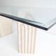 Dining table in travertine and glass with sculpted legs, 1970s.