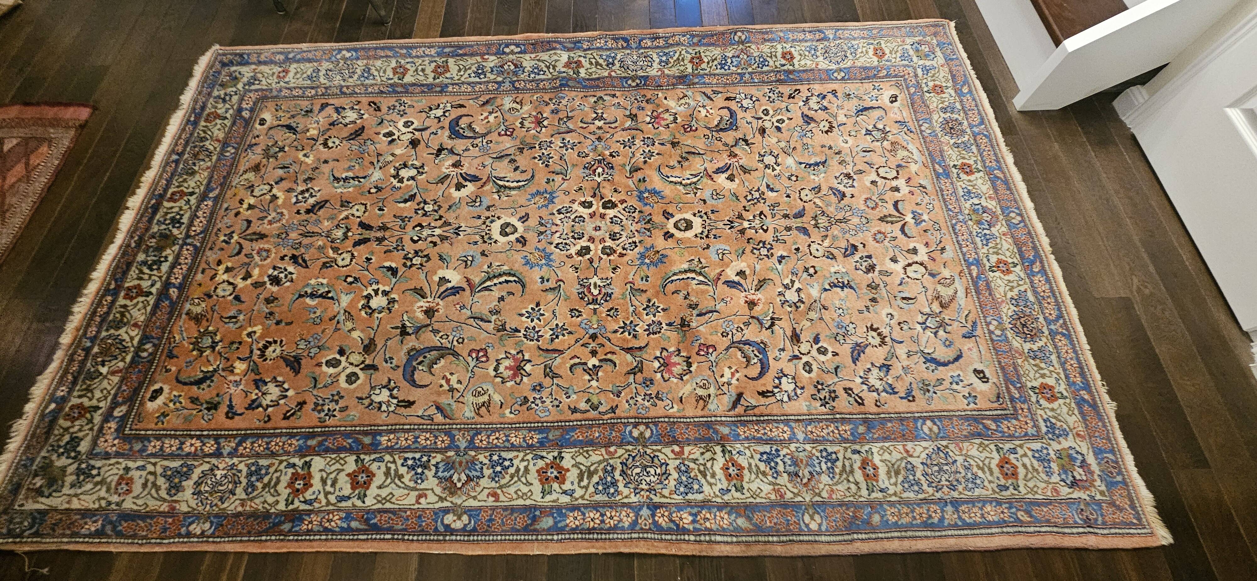 Large wool and silk oriental carpet.