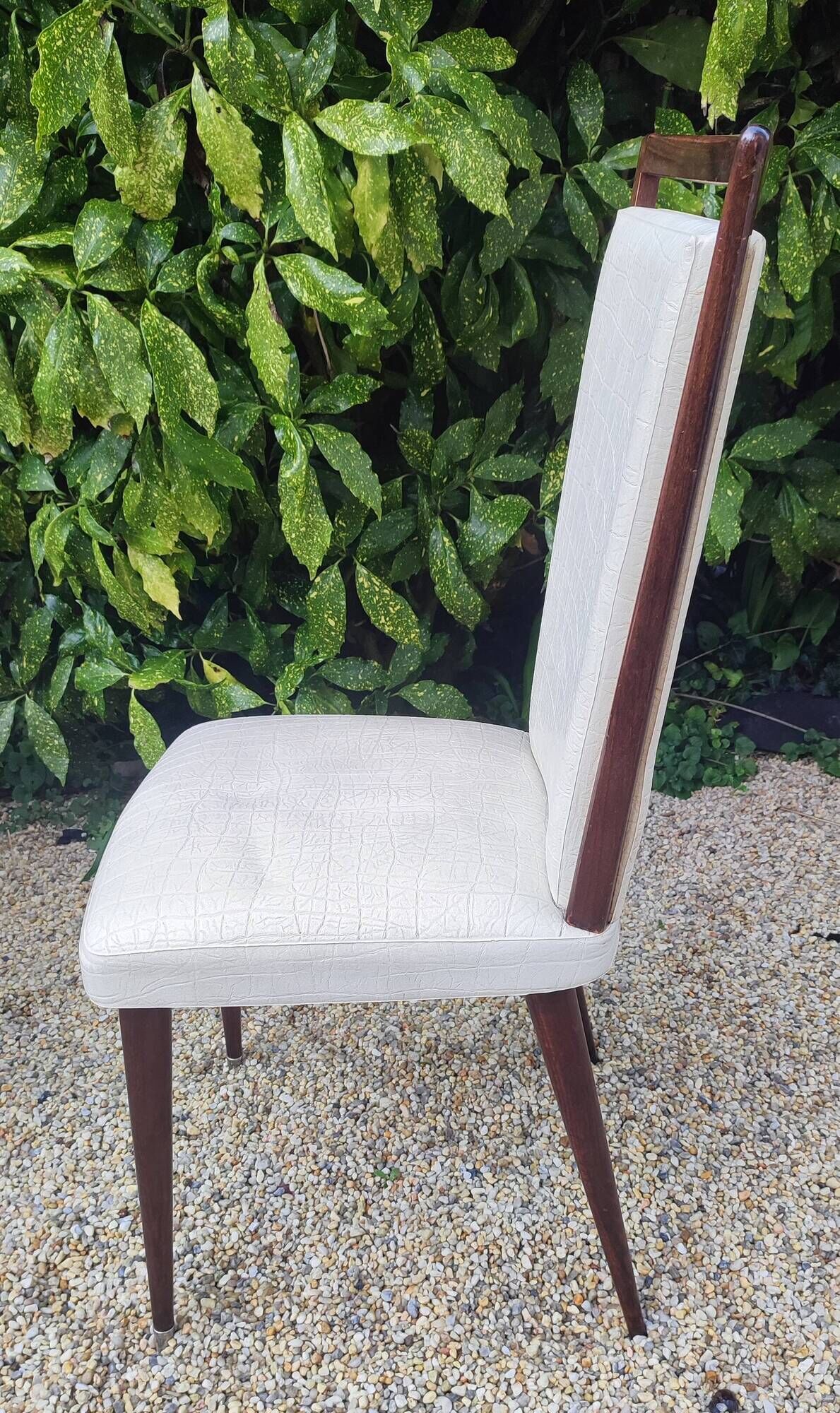 Set of 4 Vintage Mid-Century Modern Chairs with tapered metal legs.
