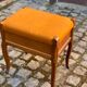 Louis XV piano stool in solid oak wood and orange fabric