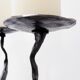 Large wrought iron candelabrum with an abstract design and three candle holders.