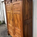 Empire wardrobe in solid walnut, France, mid-19th century.