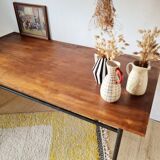 Metal tubular base table with a wooden top.