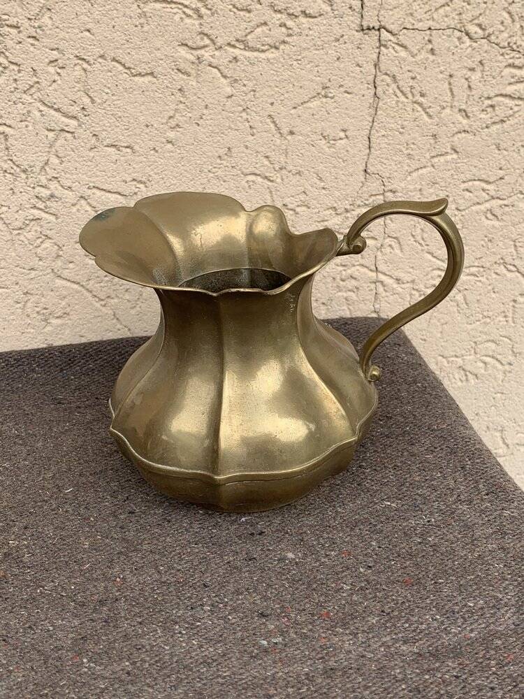 Vintage brass pitcher with "petal" patterns — decorative S-shaped handle, 1950s.