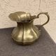 Vintage brass pitcher with "petal" patterns — decorative S-shaped handle, 1950s.