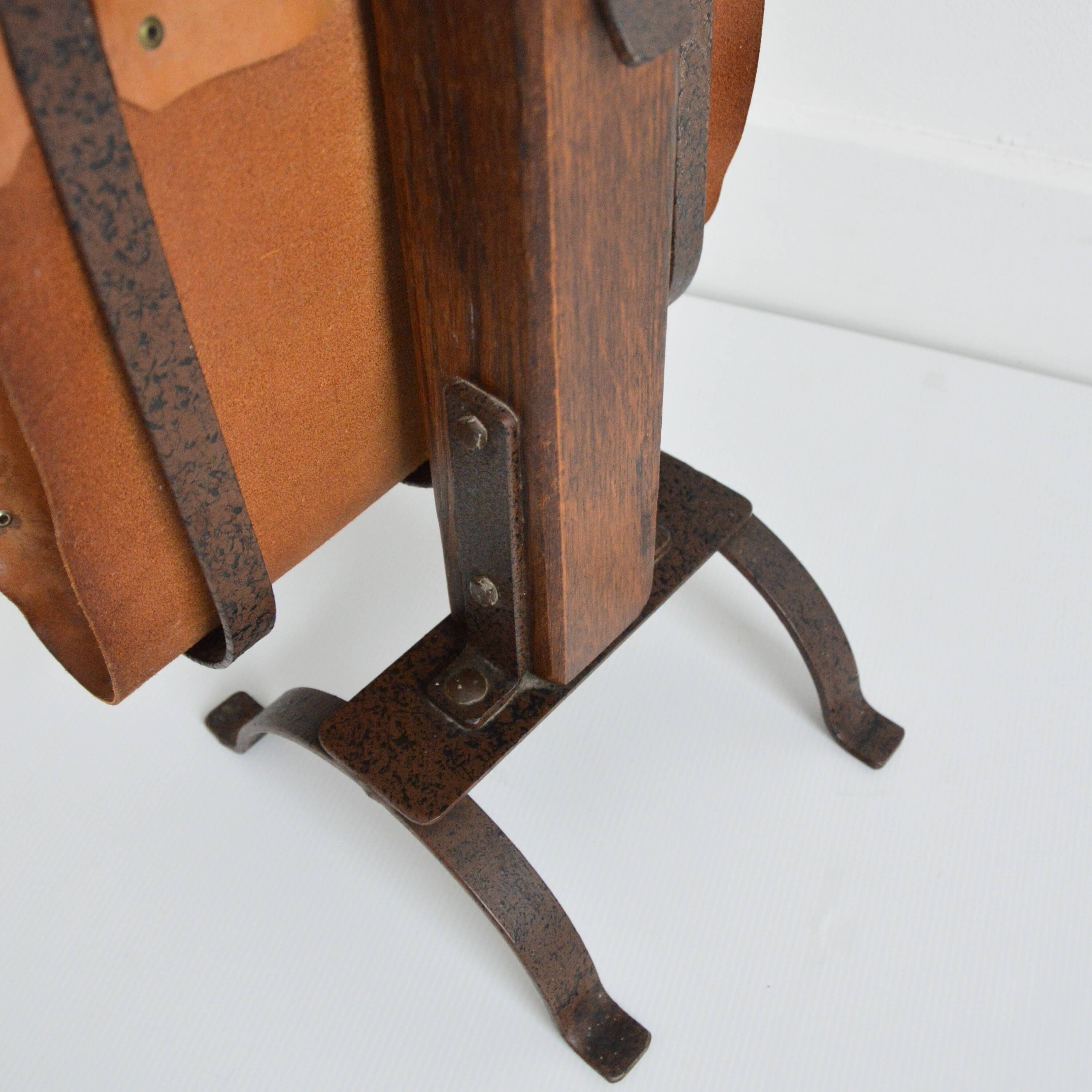 Vintage leather magazine rack with shelf and brutalist/rustic ashtray.