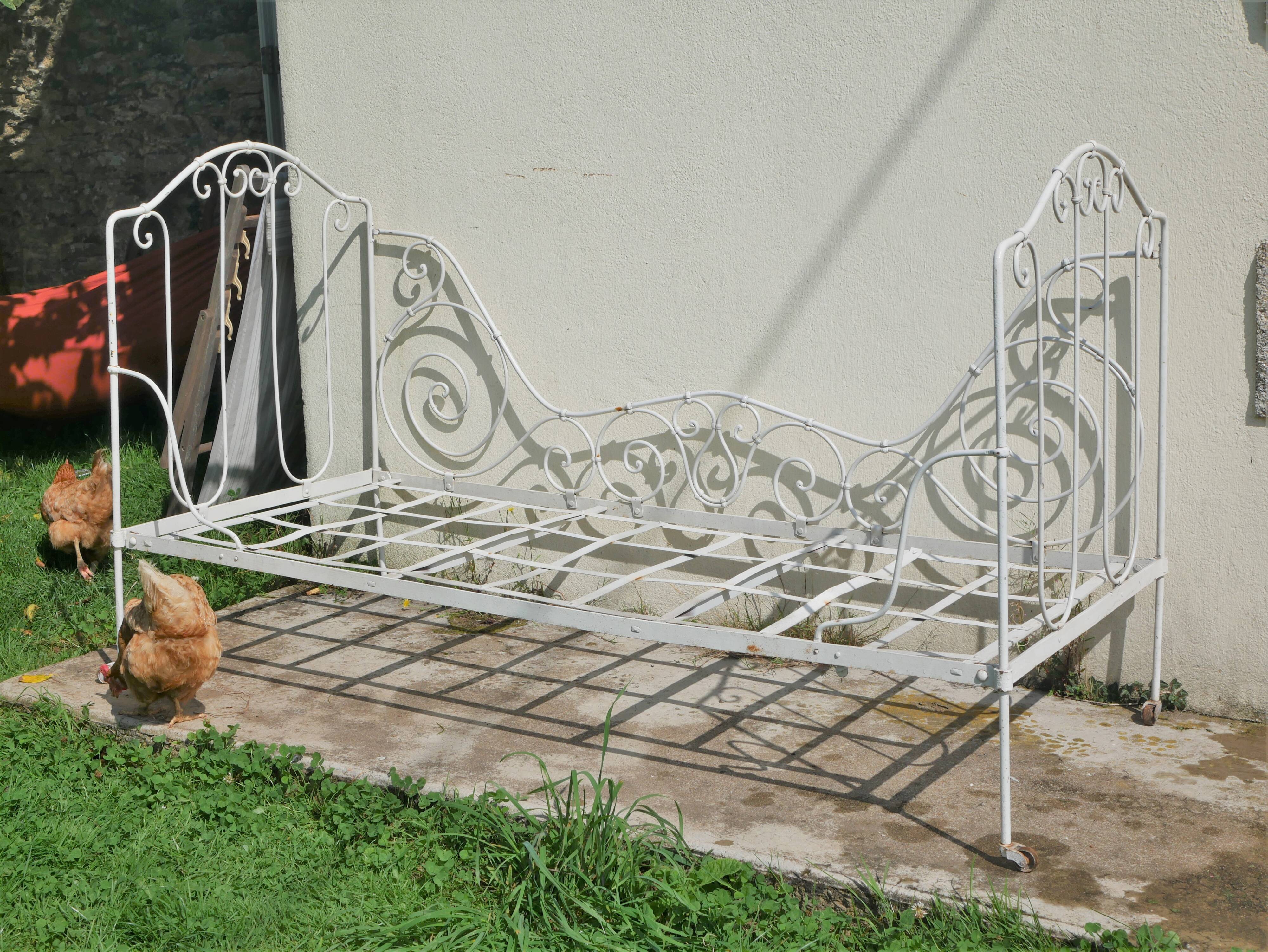 Old wrought iron bed bench