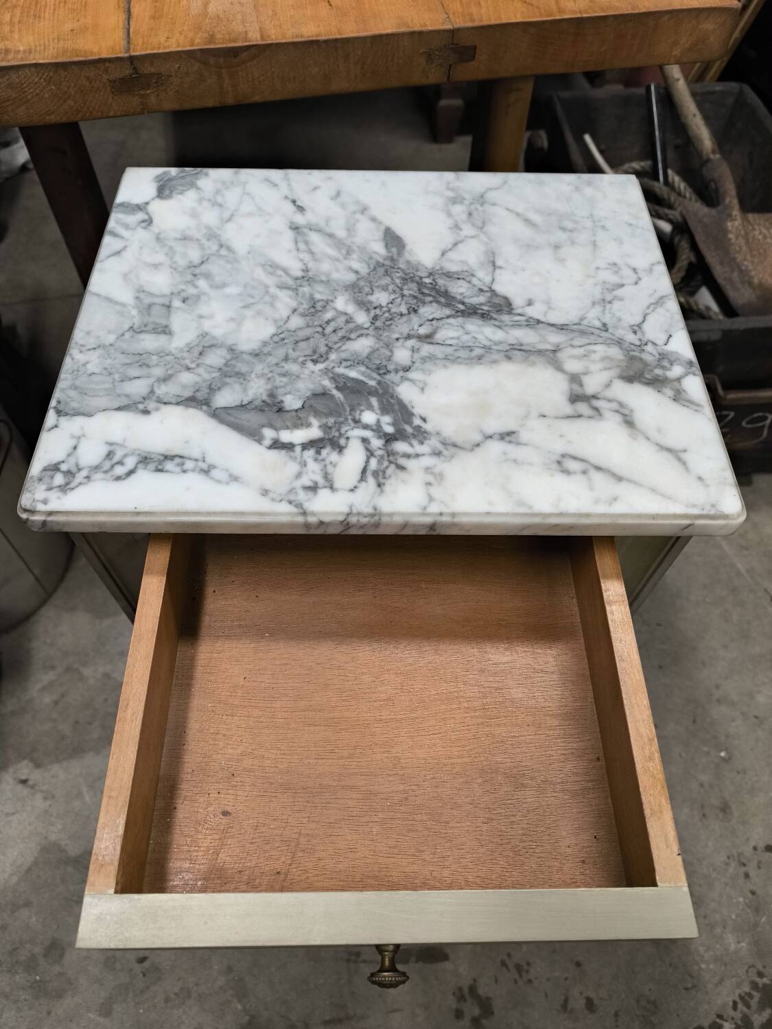 Vintage green patinated bedside table with marble and drawer
