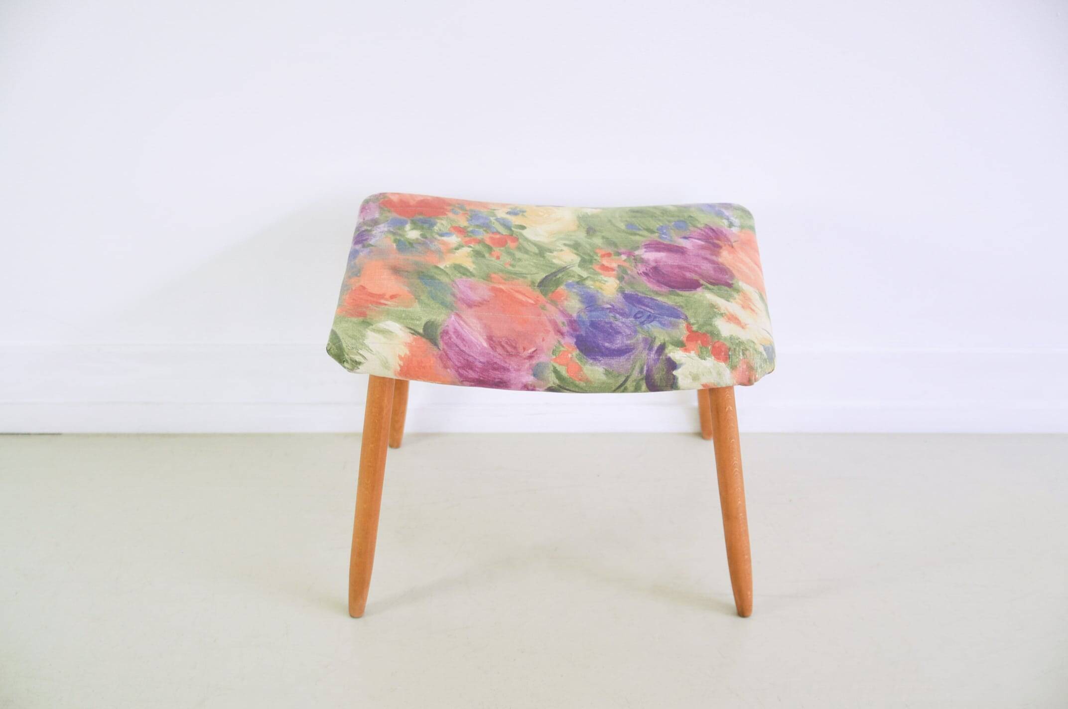 Footstool with flowered fabric