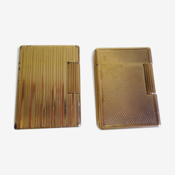 2 st dupont lighters, gold plated, punches, numbered, 1 striated pattern, 1 hammered pattern, 70s