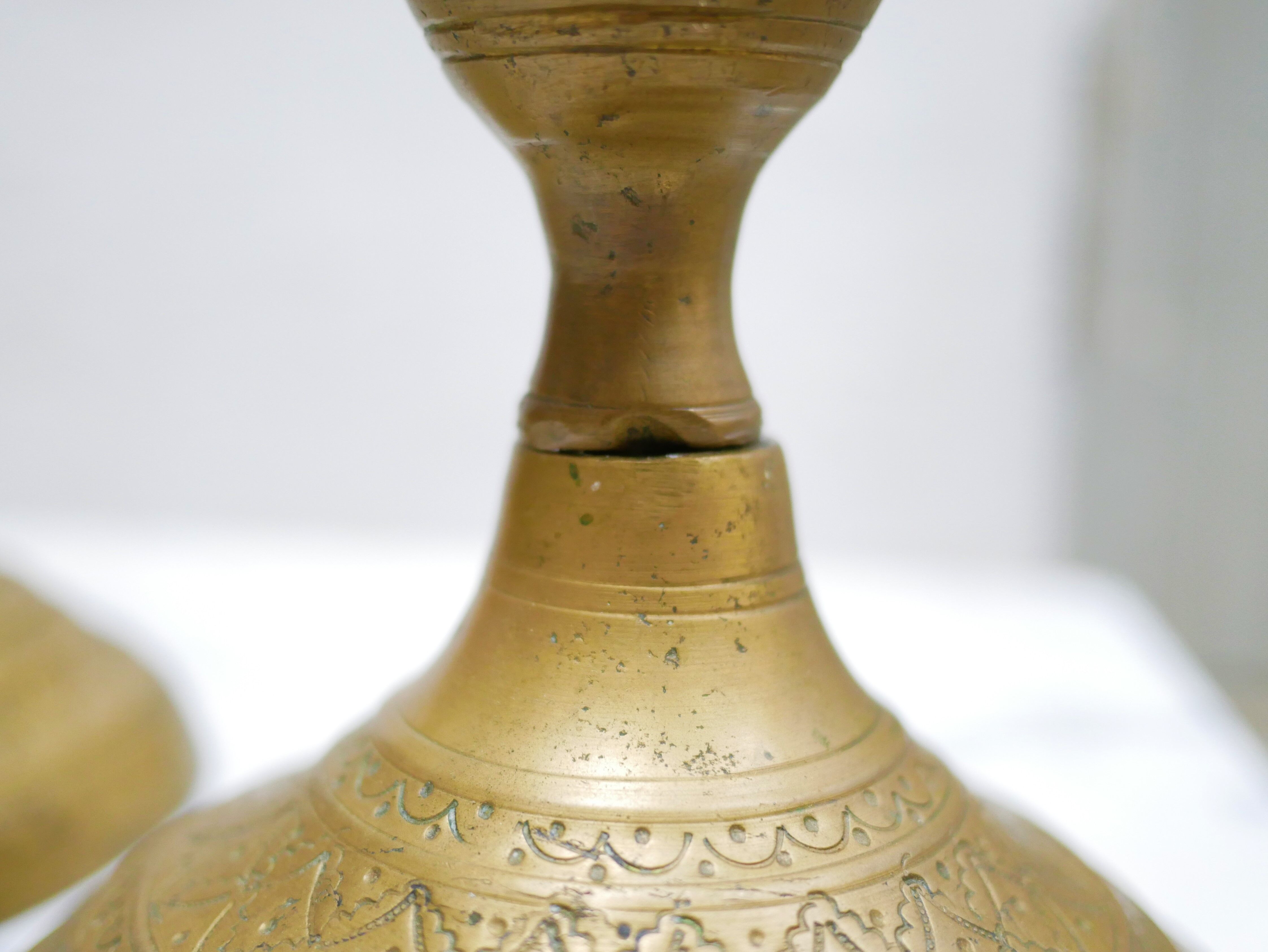 Pair of vintage candle holders in golden brass