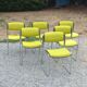 Set of 6 designer chairs with wooden seats and backs, chrome legs.