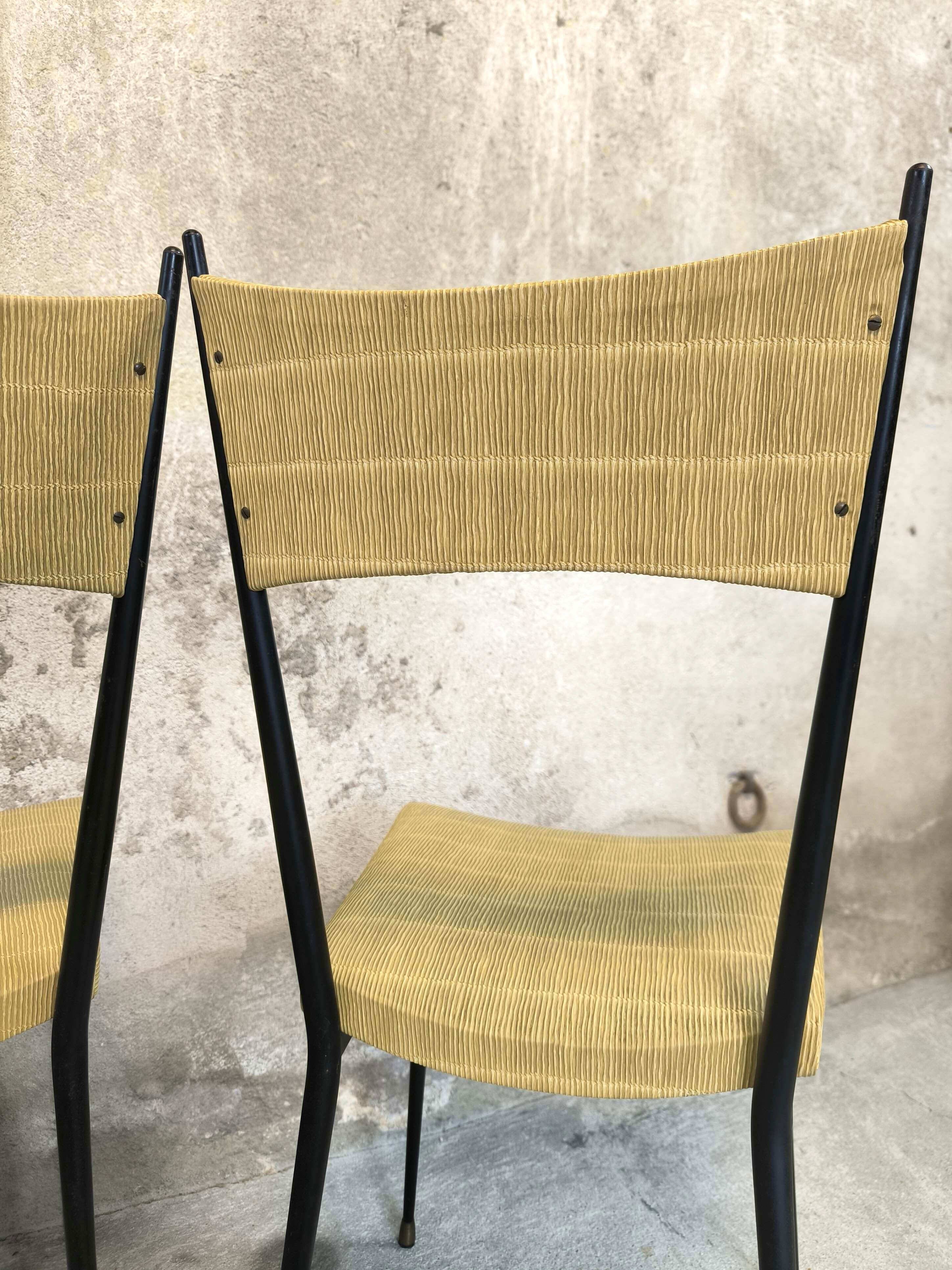 Three vintage chairs in the style of Colette Gueden.