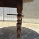 Round dining table with a drop-leaf top in solid walnut, late 19th century.