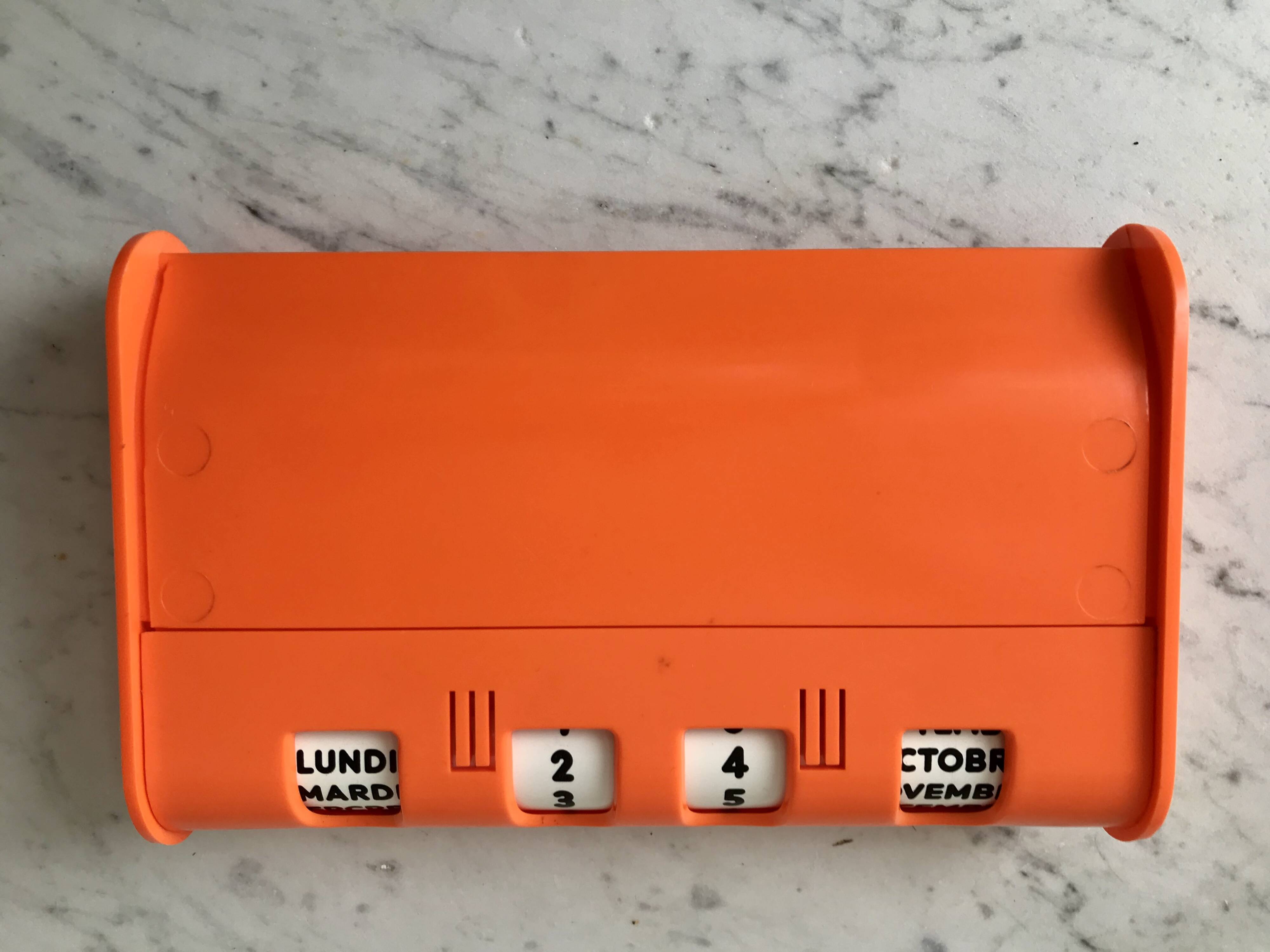 Dater empty pocket in orange plastic seventies 70s