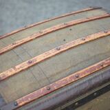 Antique trunk made of burlap and iron, storage suitcase