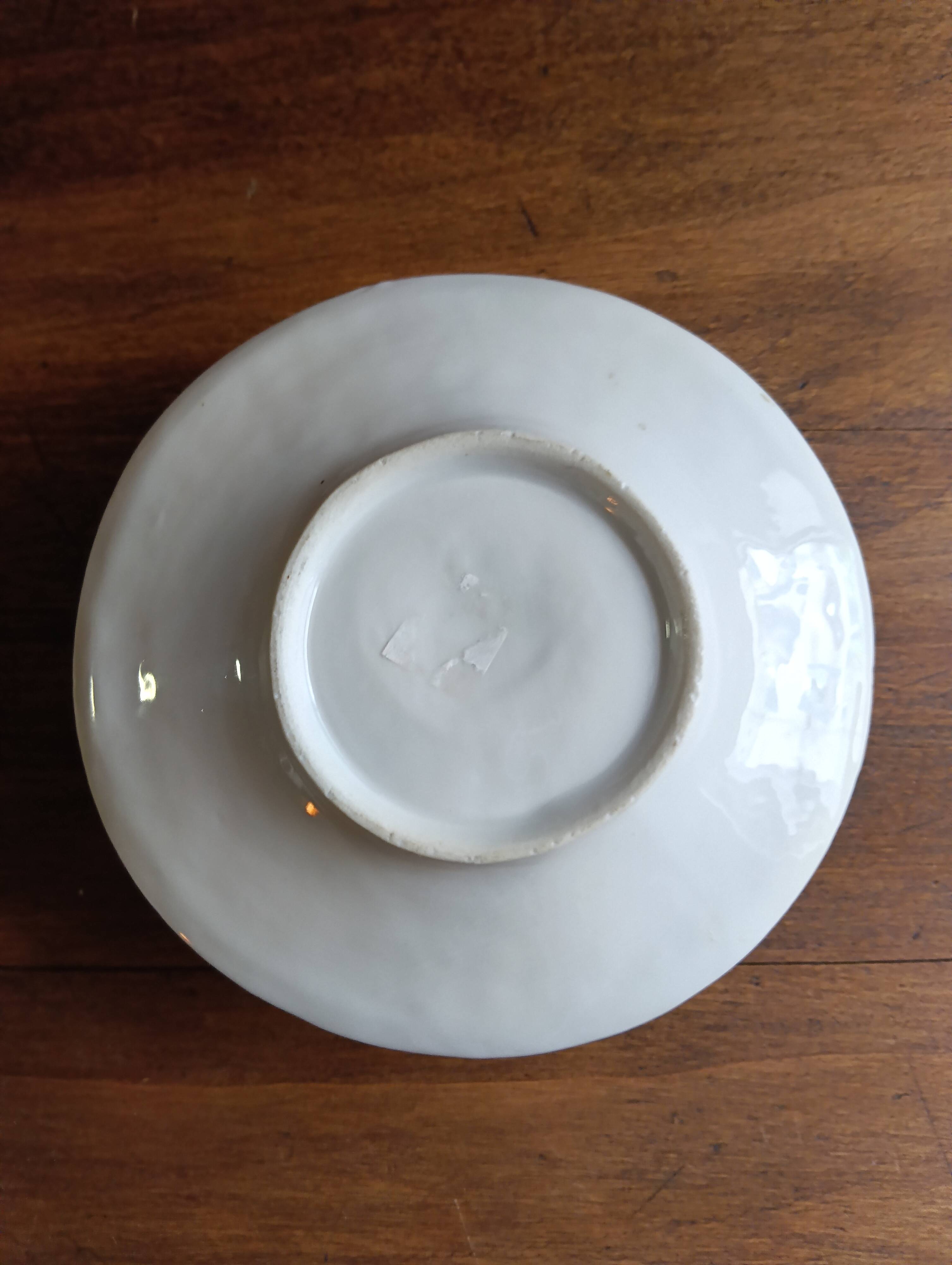 Antique handheld candle holder in porcelain