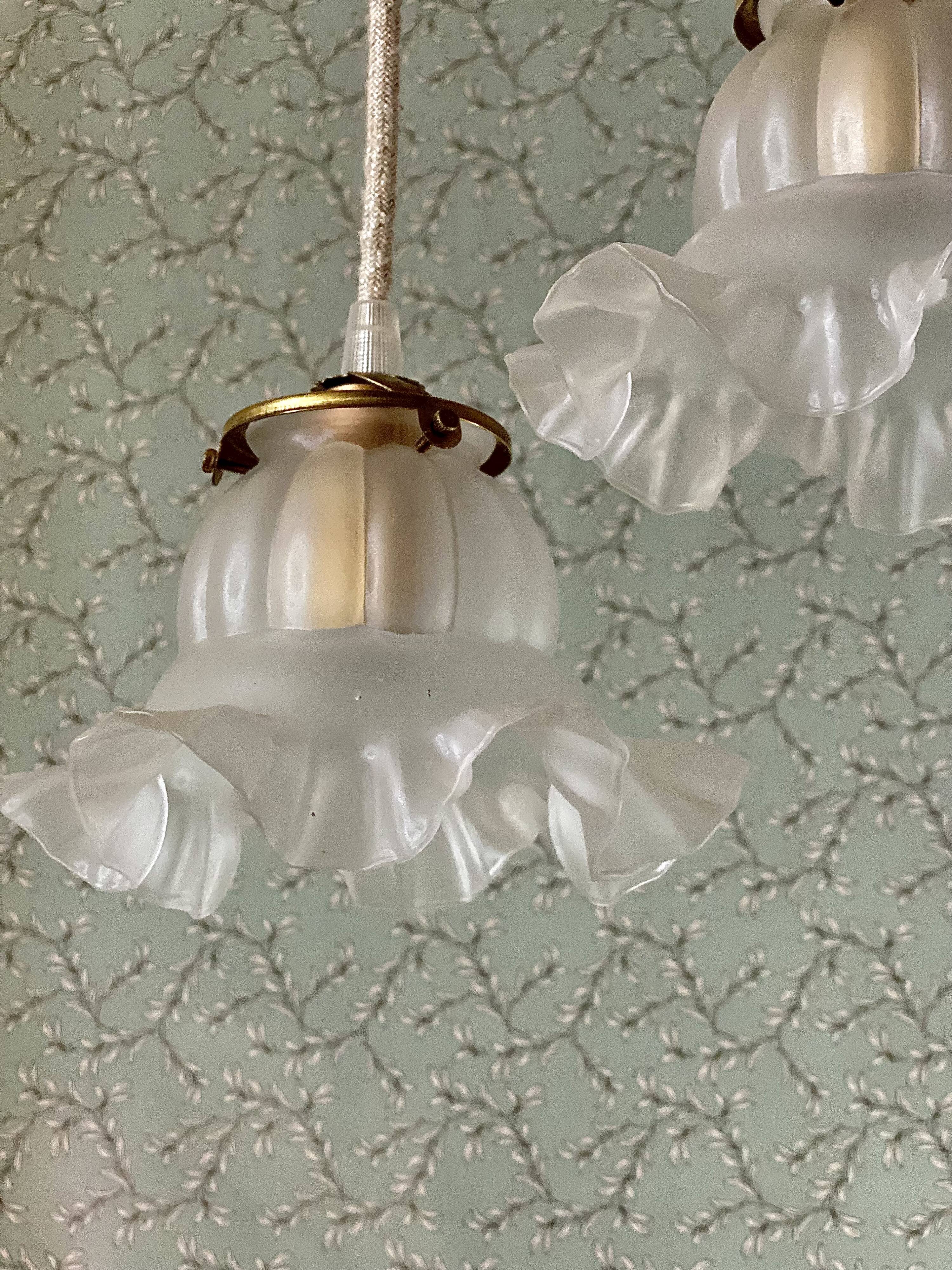 Two vintage tulip pendant lights in molded glass