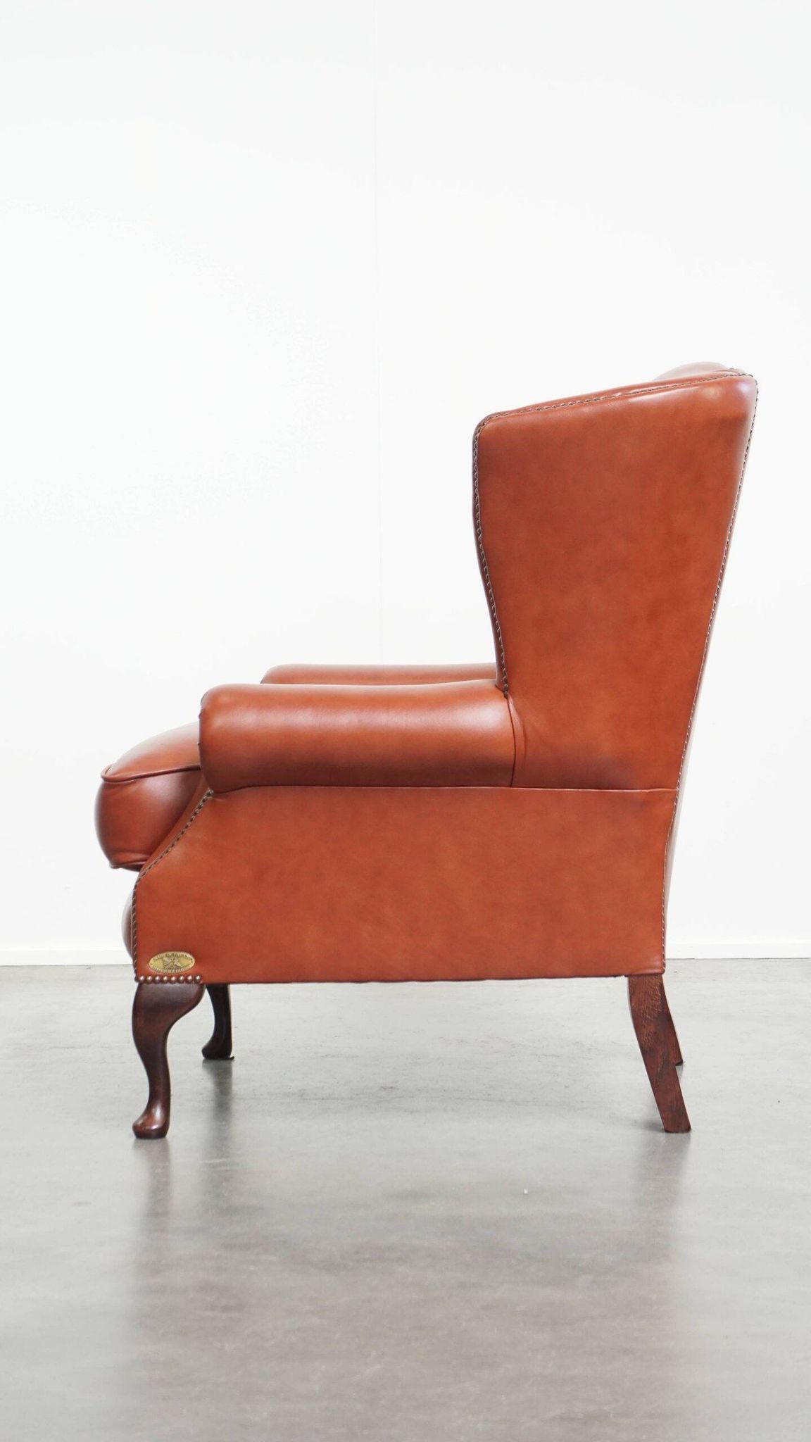 Elegant smooth English cowhide leather Chesterfield wingback armchair
