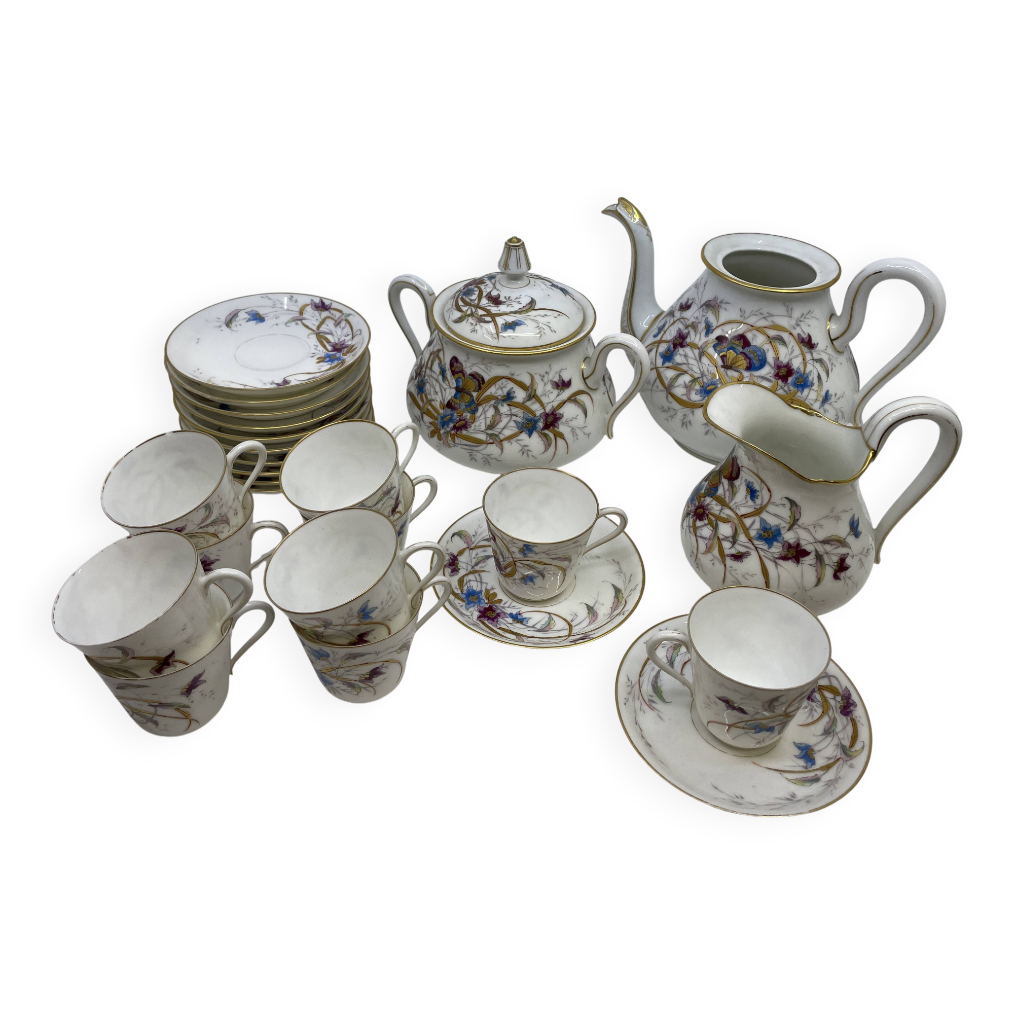 Porcelain tea service with floral and butterfly decorations, 25 pieces.
