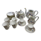 Porcelain tea service with floral and butterfly decorations, 25 pieces.