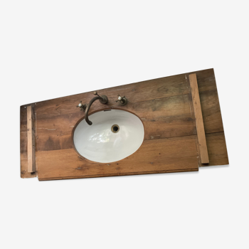 Washbasin recessed in old wood