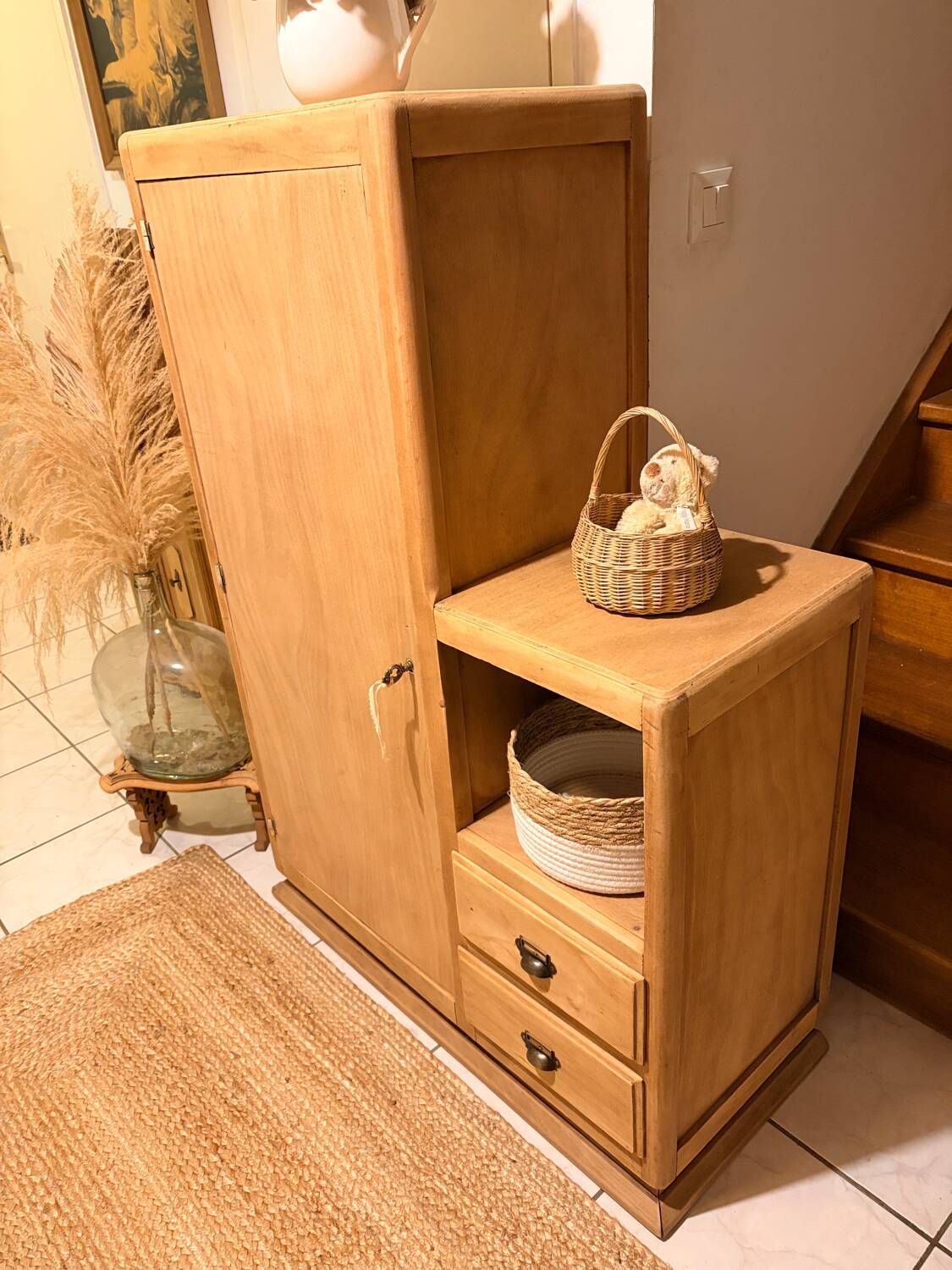 Asymmetrical cabinet made of raw wood