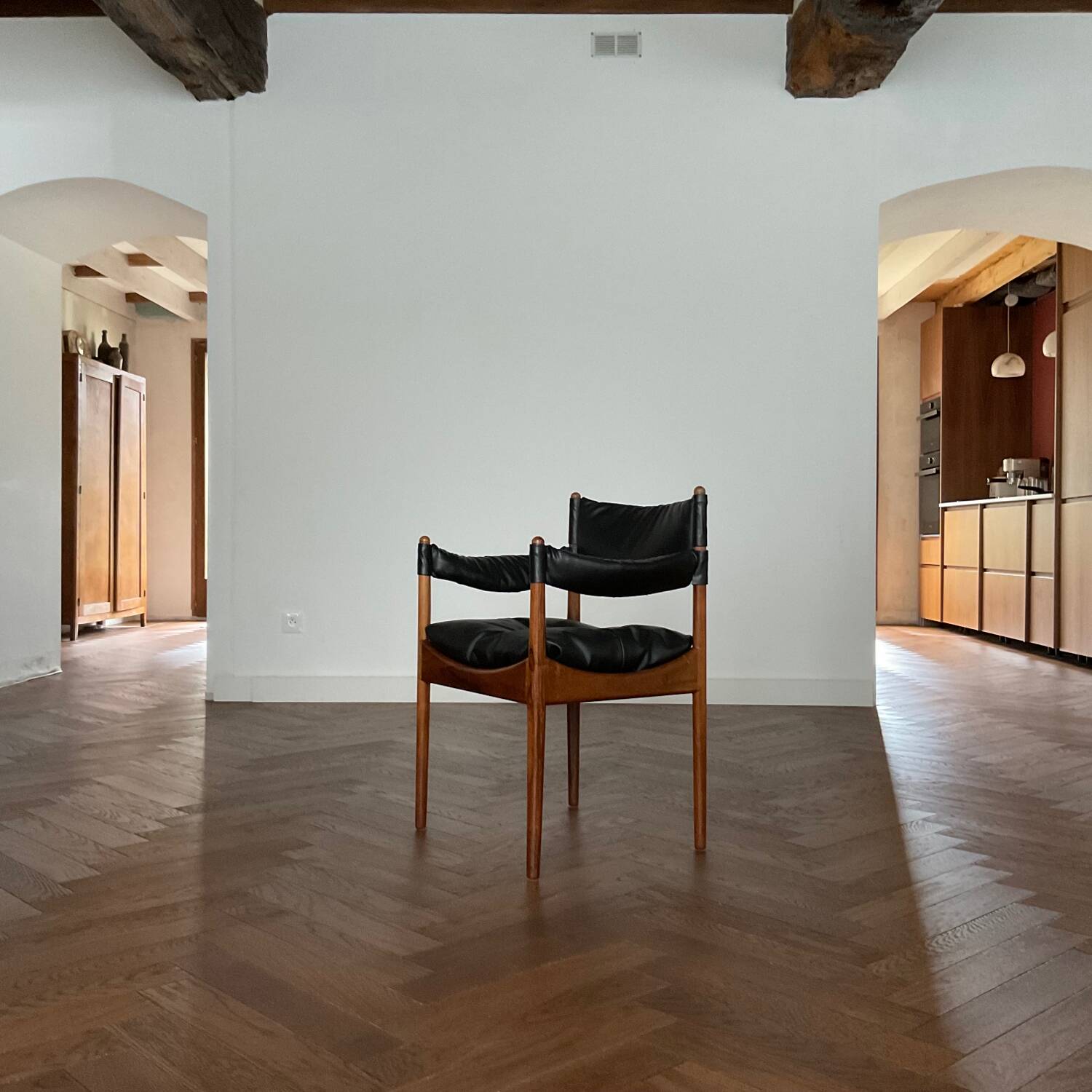 Chair with armrests by Kristian Solmer Vedel