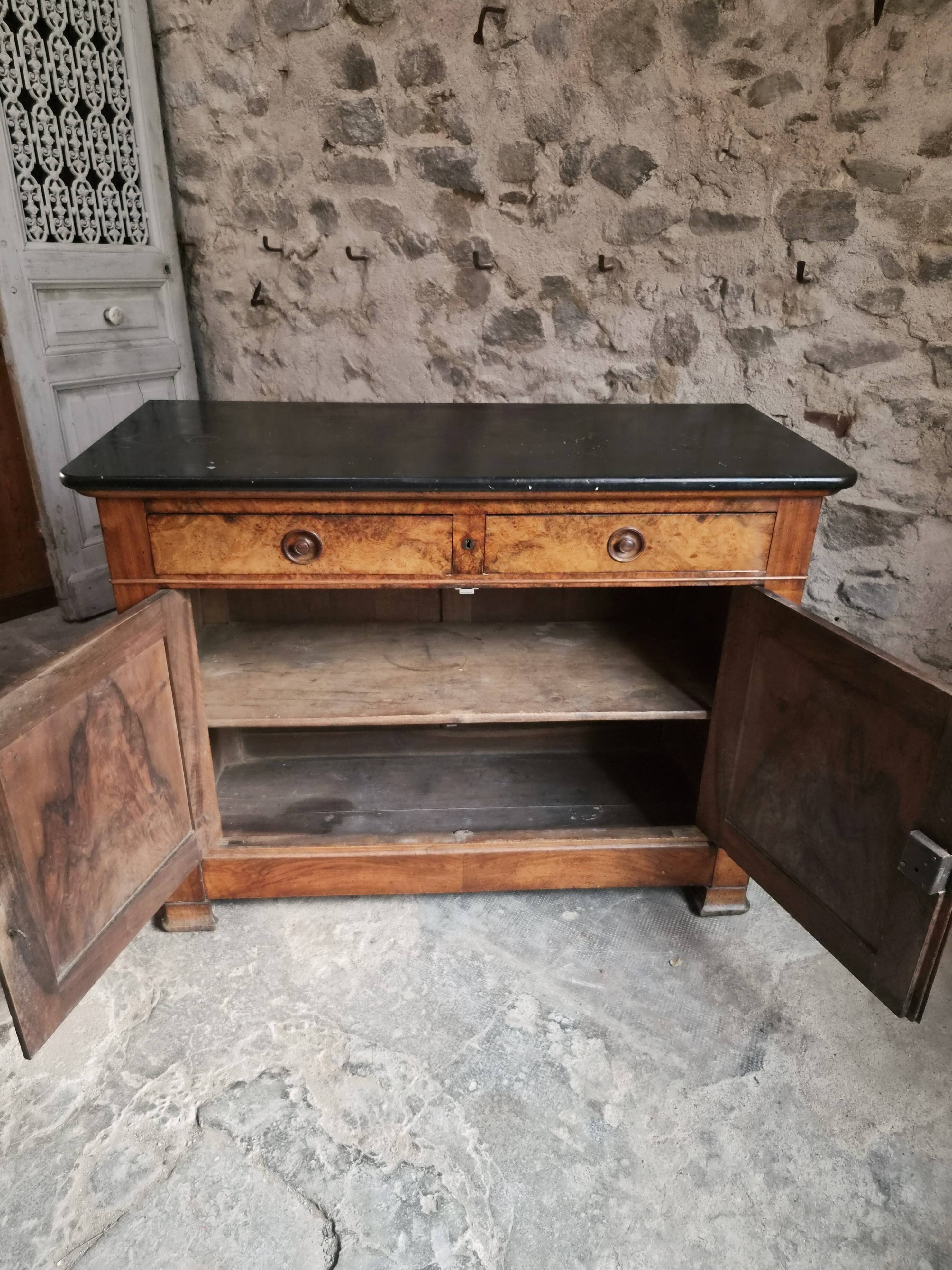 French Louis Philippe walnut buffet with black marble top, France, circa 1840–1860.