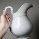 Antique white earthenware toilet jug from Pexonne, France