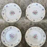 Set of 4 plates with floral motif, golden border early twentieth century