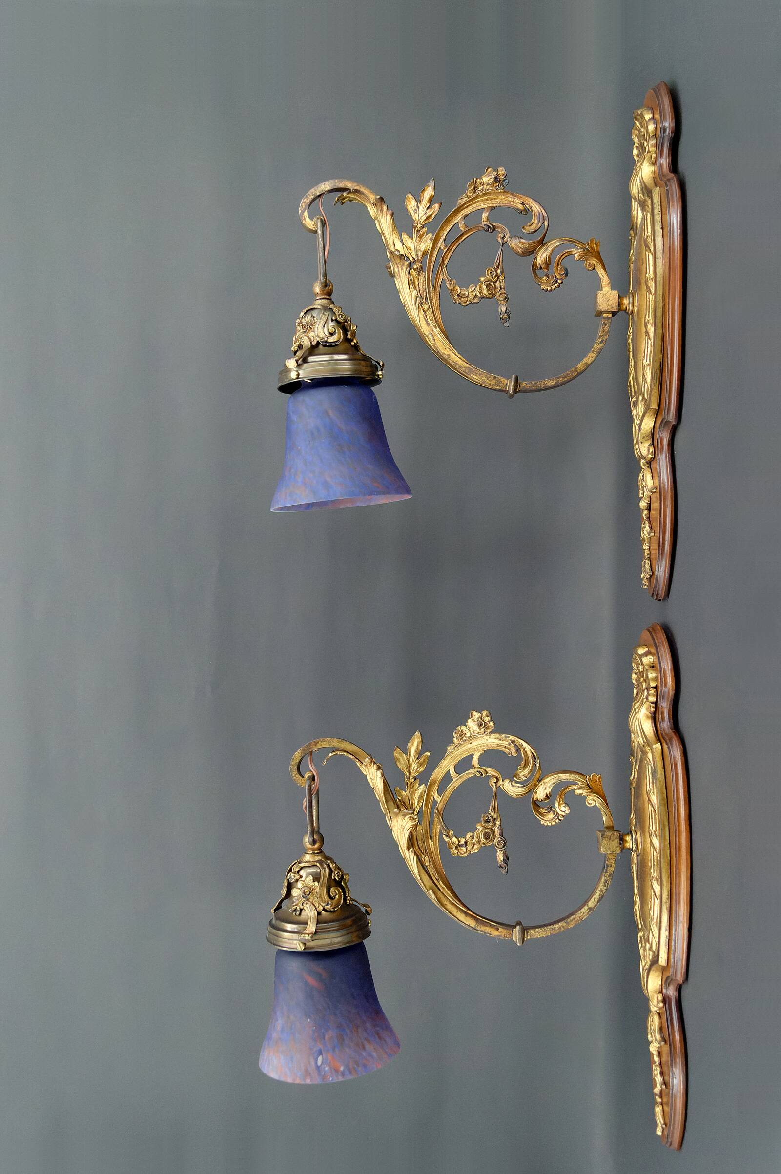 Pair of Rococo / Louis XV wall lights in gilded bronze, walnut bases and glass tulips, France, Circ