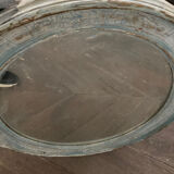 Patinated oval mirror