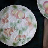 Two slip plates decorated with fruit.