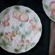 Two slip plates decorated with fruit.
