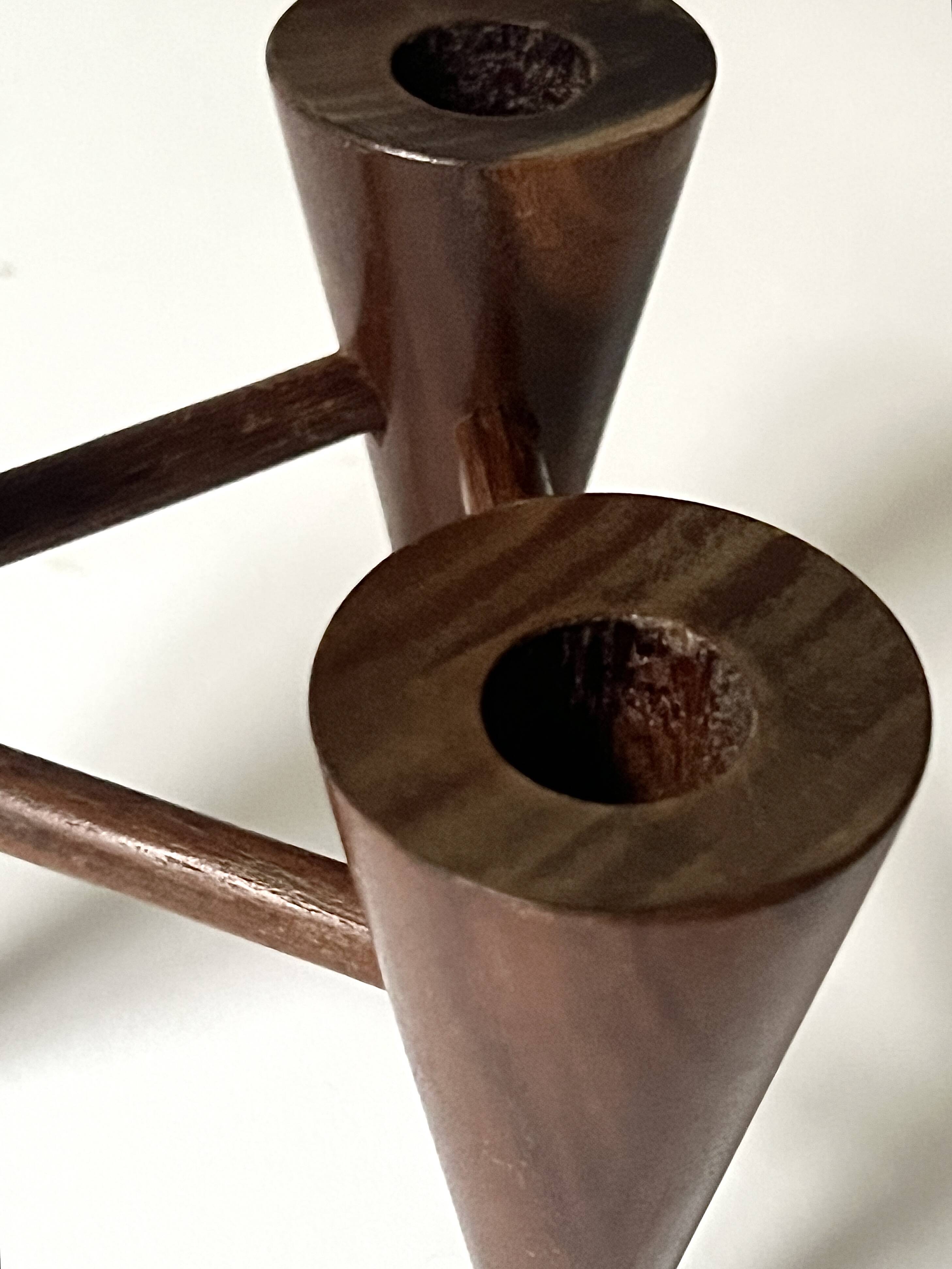 Scandinavian tripod candle holder in carved wood, design from around 1970.