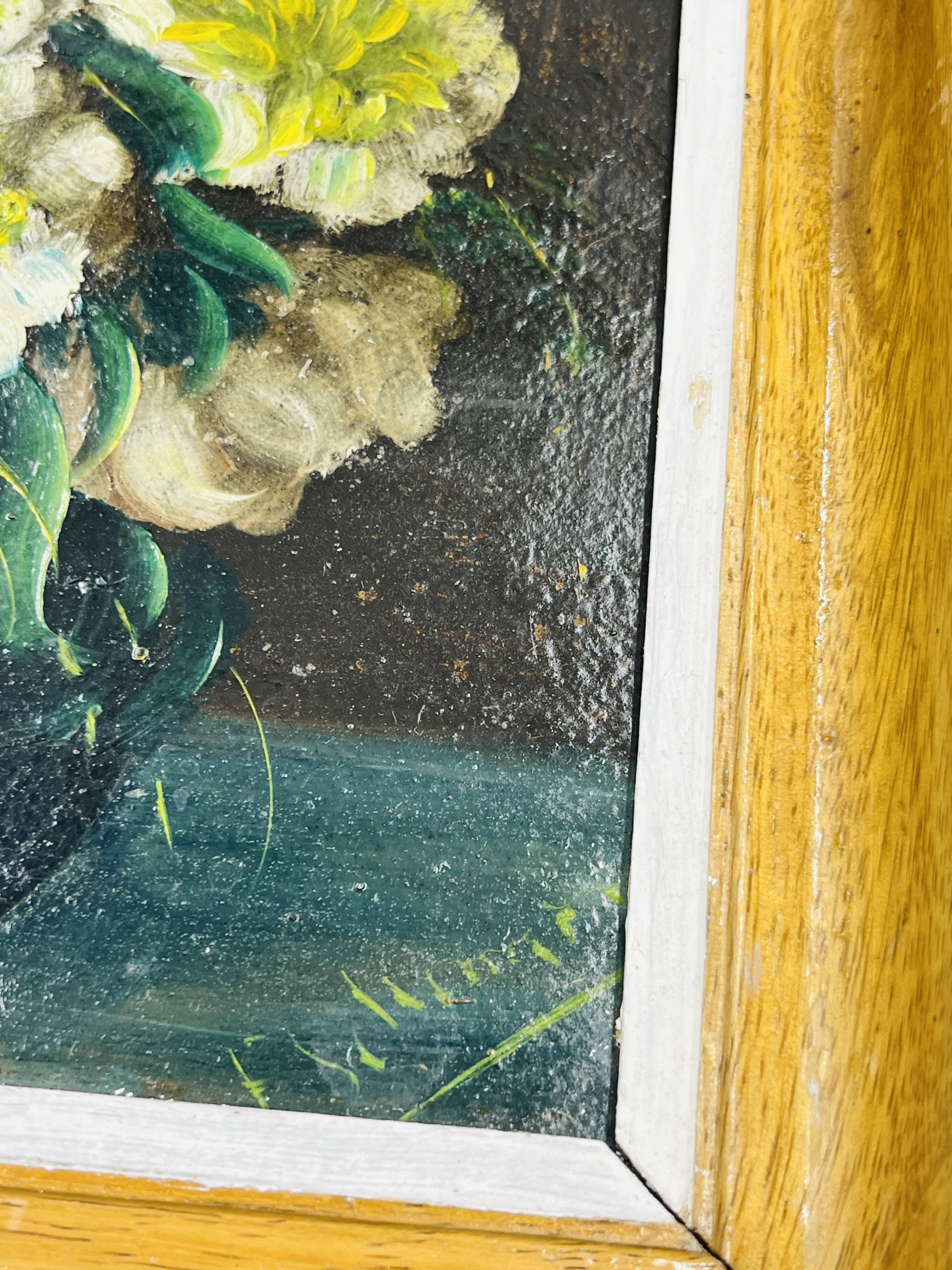 Pair of small framed vintage floral oils