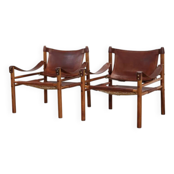Deux fauteuils Arne Norell Sirocco en palissandre et cuir.