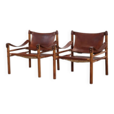 Deux fauteuils Arne Norell Sirocco en palissandre et cuir.