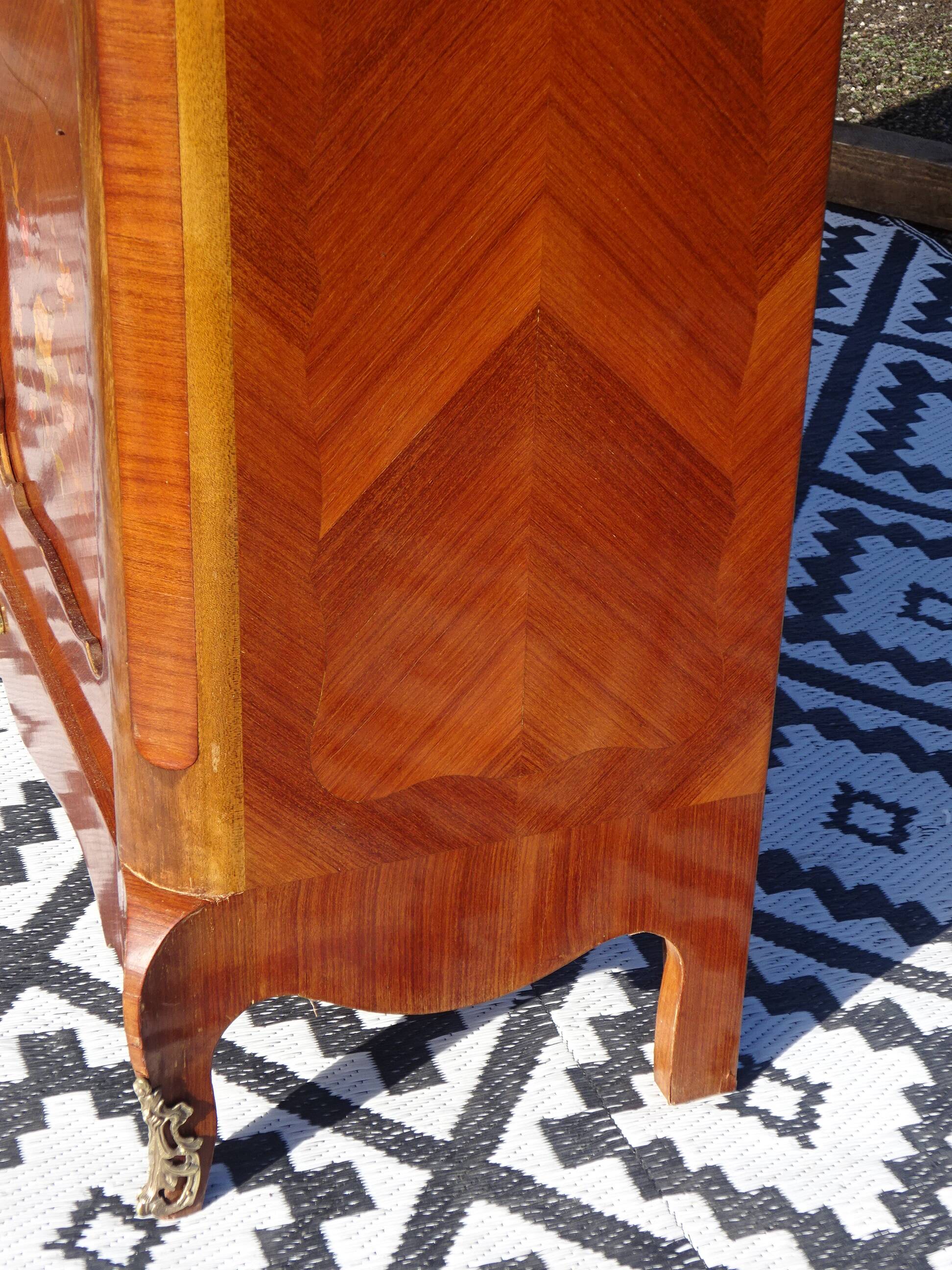 Glass library with rosewood marquetry in the Louis XV style.