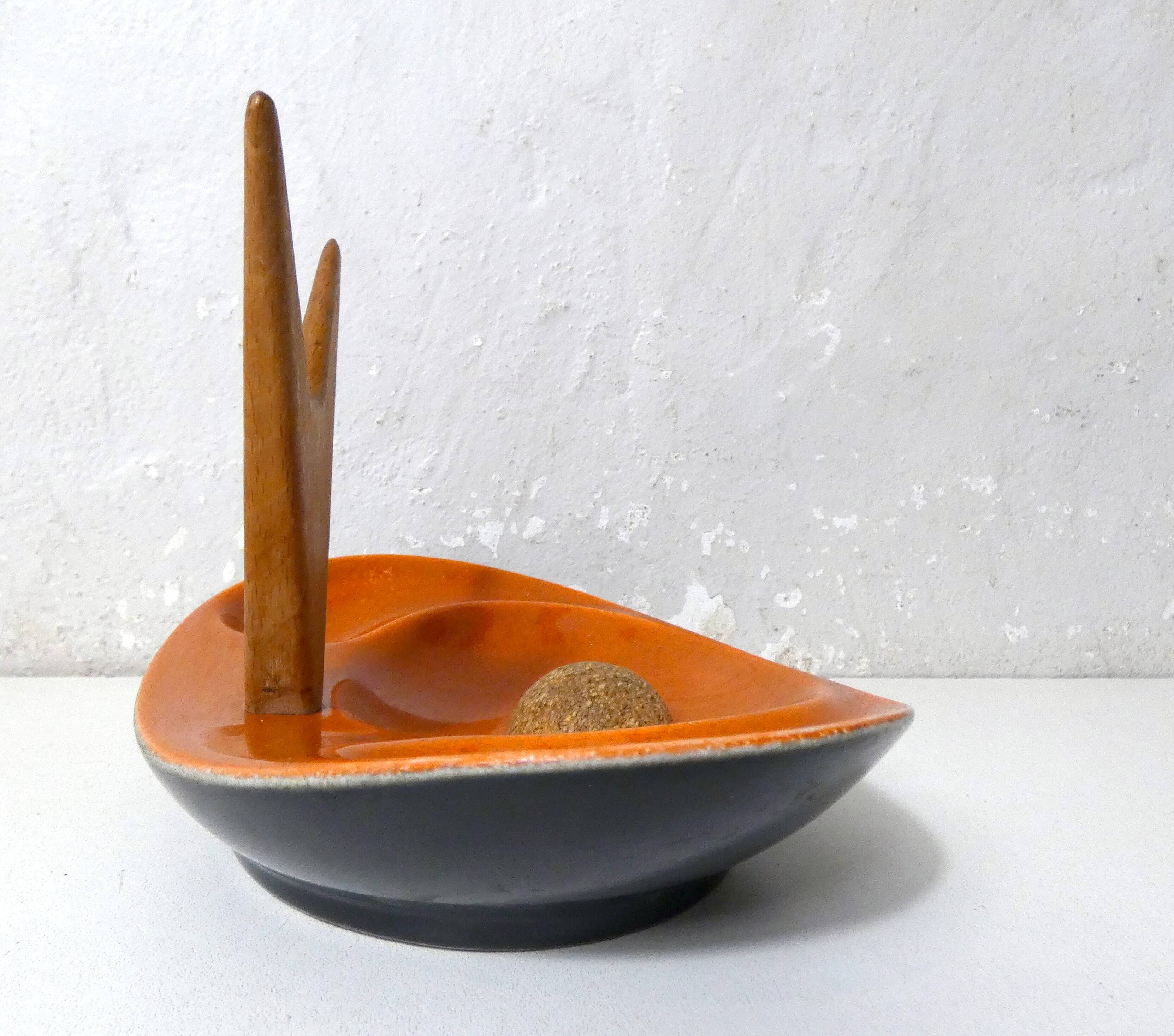 old ceramic and asymmetrical wood pipe ashtray