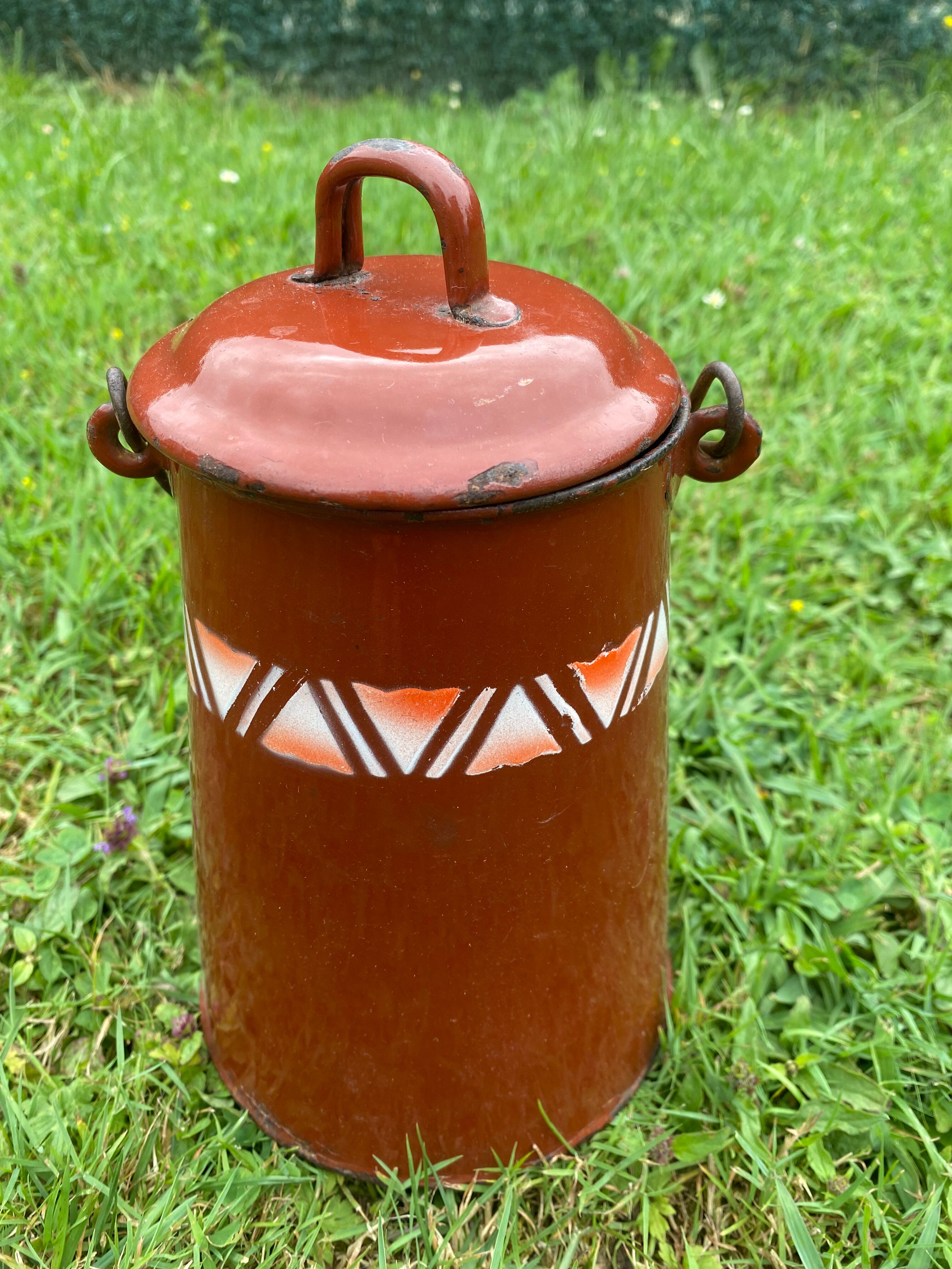 Old milk pot in enamelled sheet metal