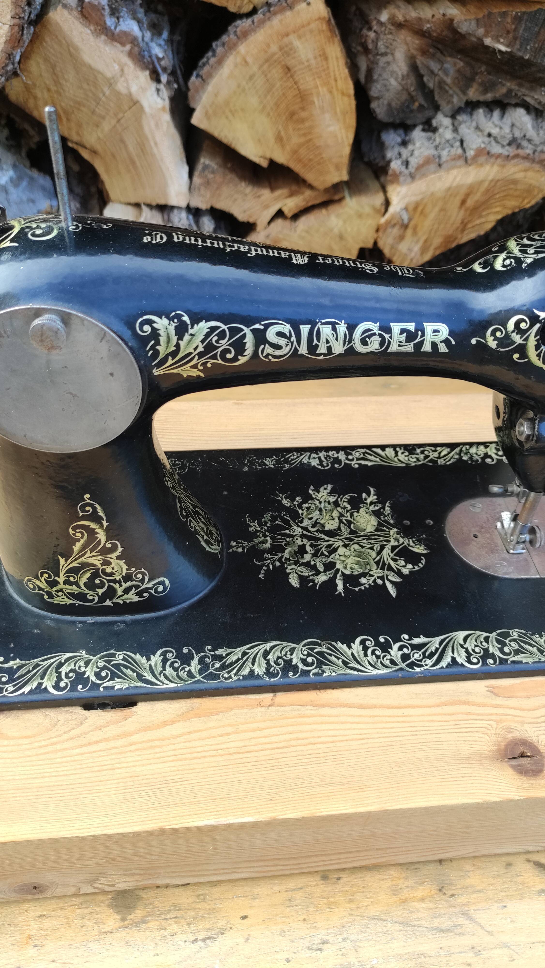 Old Singer sewing machine on pedestal