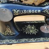 Old Singer sewing machine on pedestal