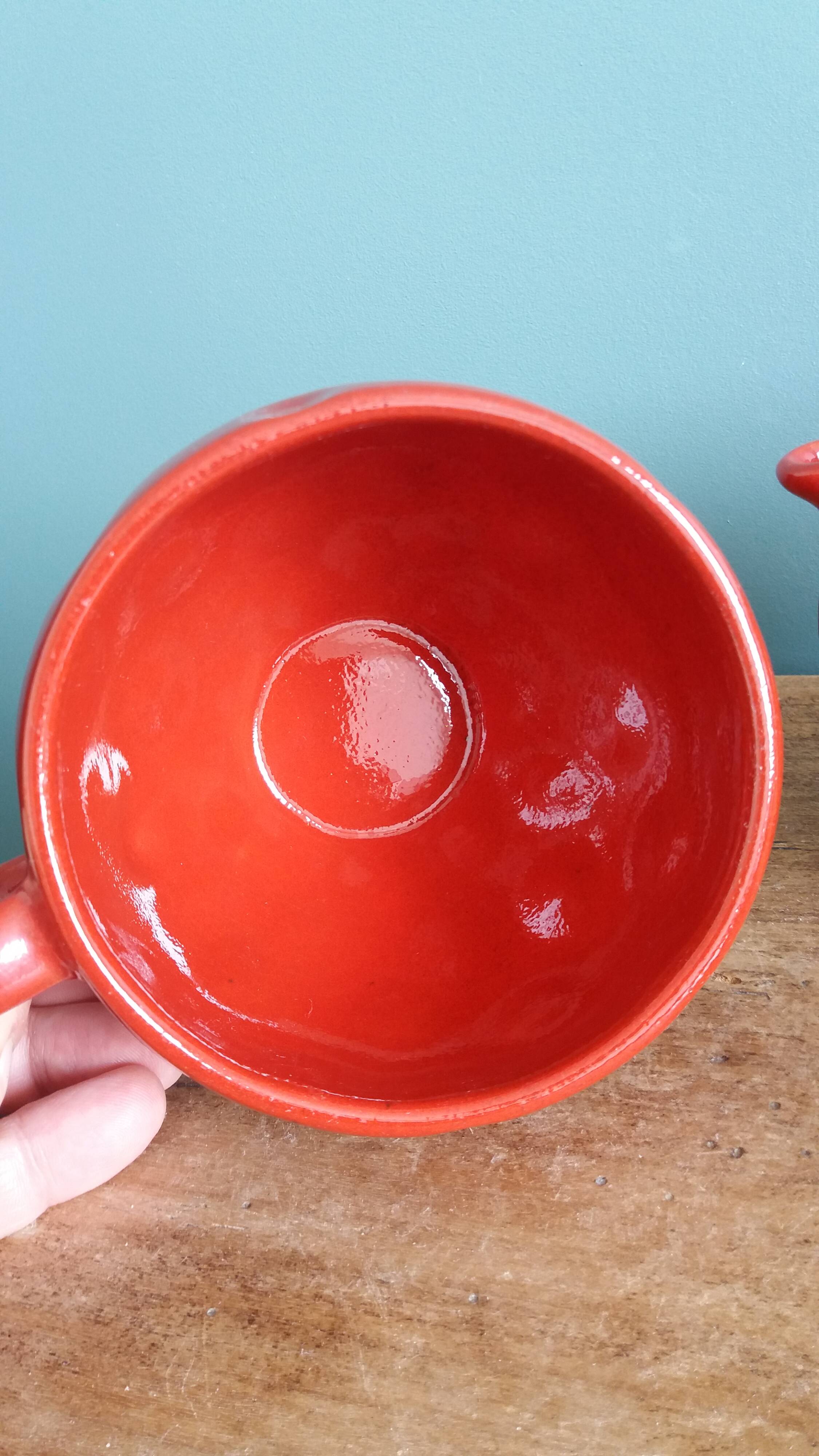 Teapot and cup in the shape of a strawberry.