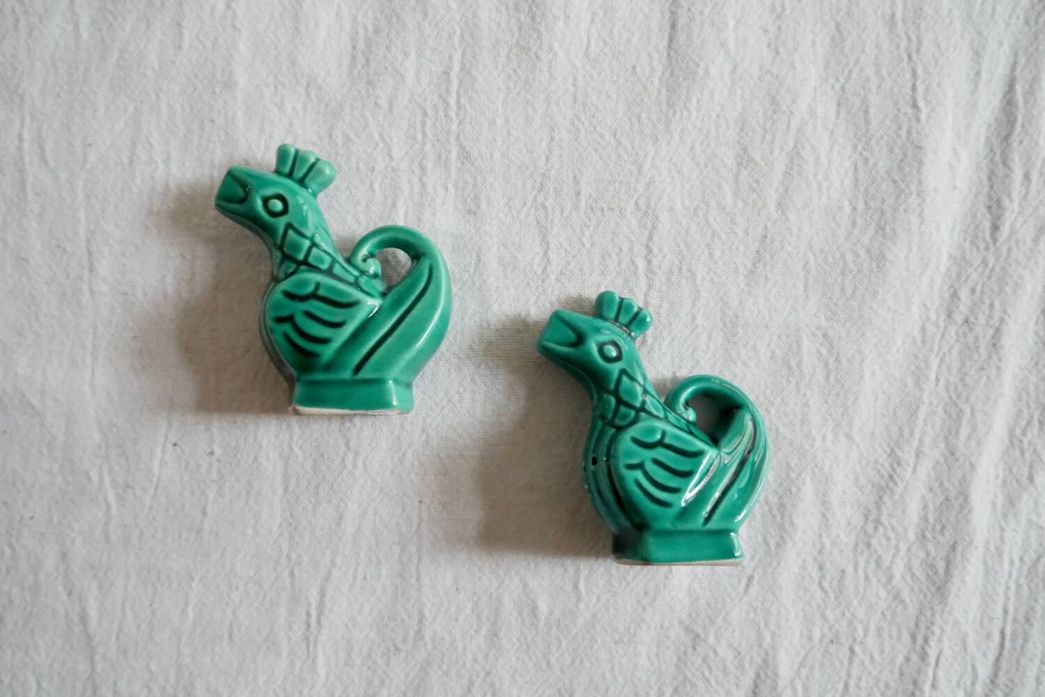 Slush salt and pepper shakers in the shape of a green rooster