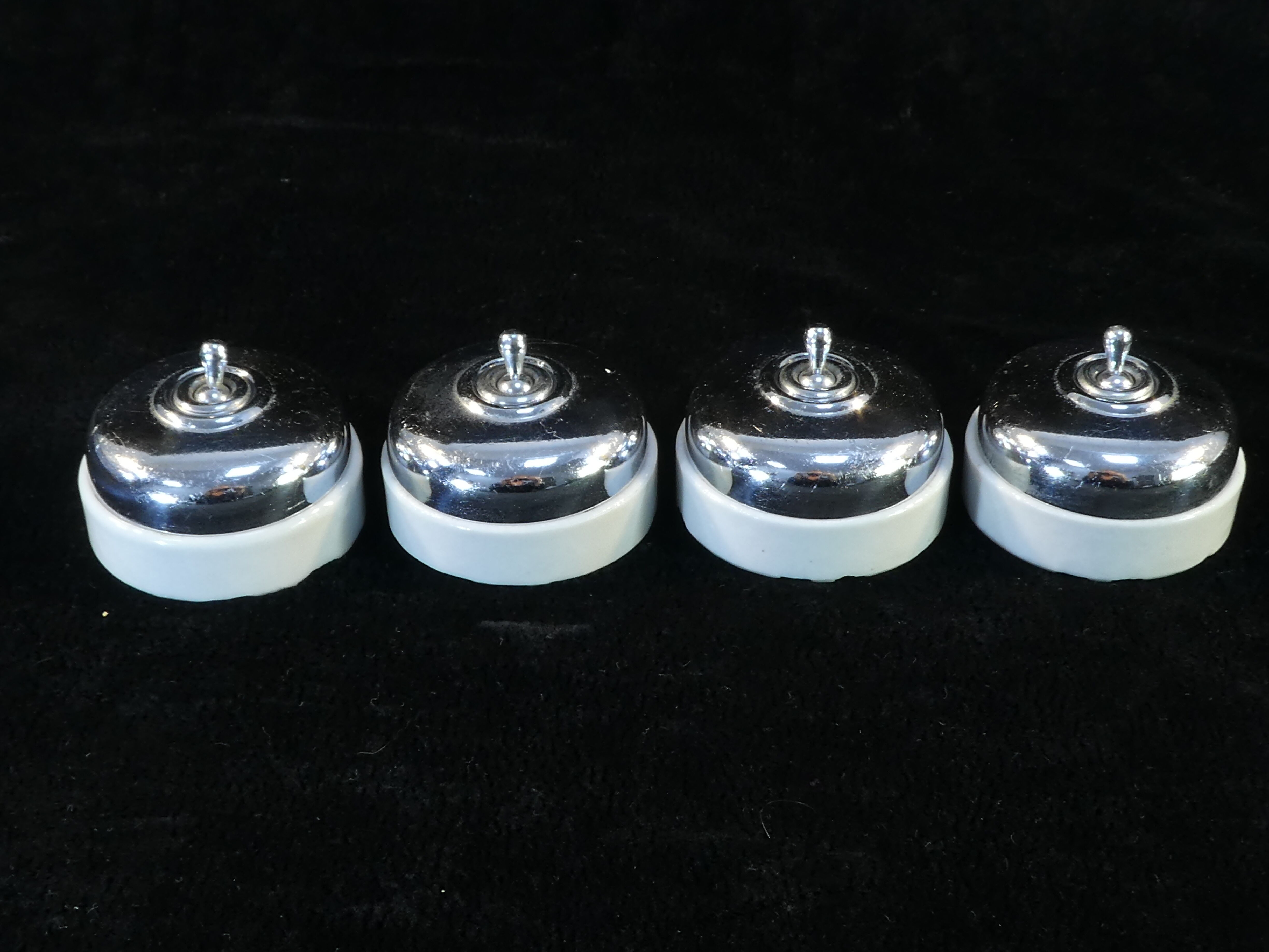 Set of 4 old porcelain and chrome switches